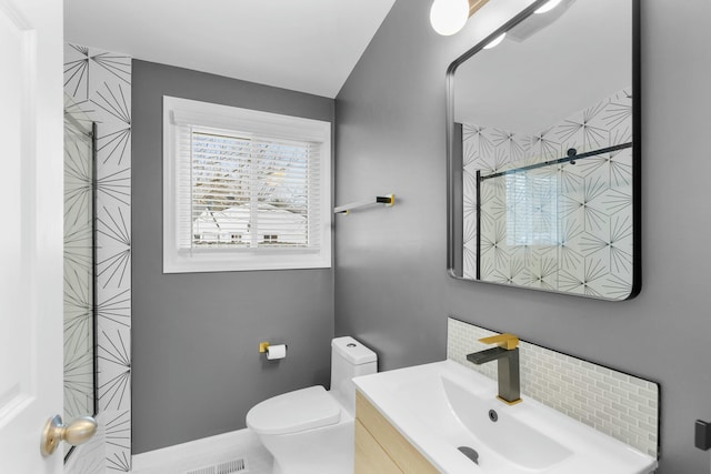2817 Cumberland Ave, Ann Arbor, MI 48104 - bathroom with toilet, vanity, and baseboards