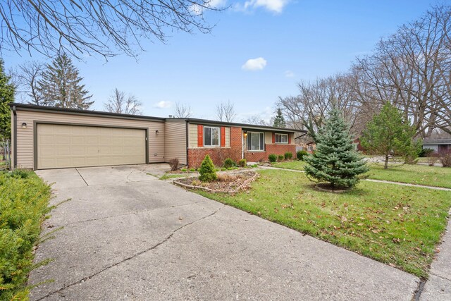 2817 Cumberland Ave, Ann Arbor, MI 48104 - single story home featuring an attached garage, concrete driveway, a front yard, and brick siding