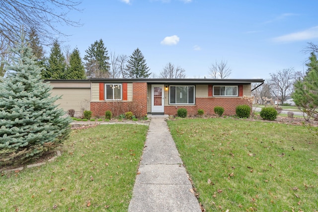 2817 Cumberland Ave, Ann Arbor, MI 48104 - ranch-style home with a front yard, brick siding, and a garage