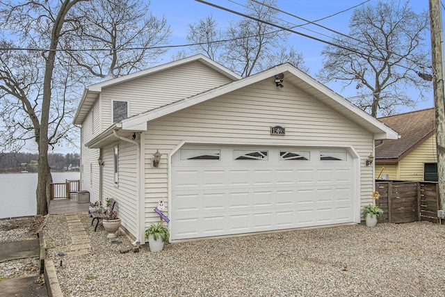 15095 N Barton Lake Dr, Vicksburg, MI 49097 - garage featuring driveway and fence