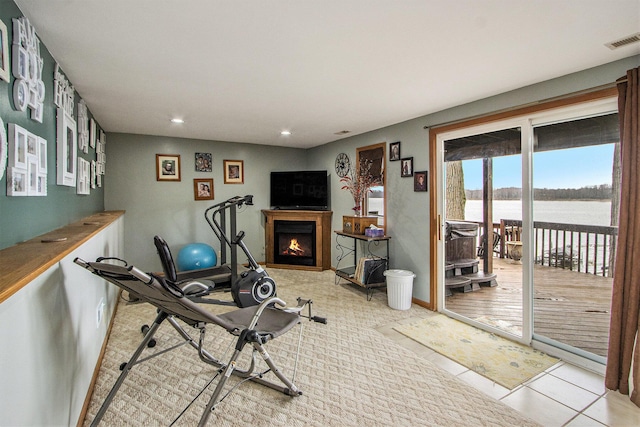 15095 N Barton Lake Dr, Vicksburg, MI 49097 - workout area with visible vents, baseboards, recessed lighting, and a lit fireplace