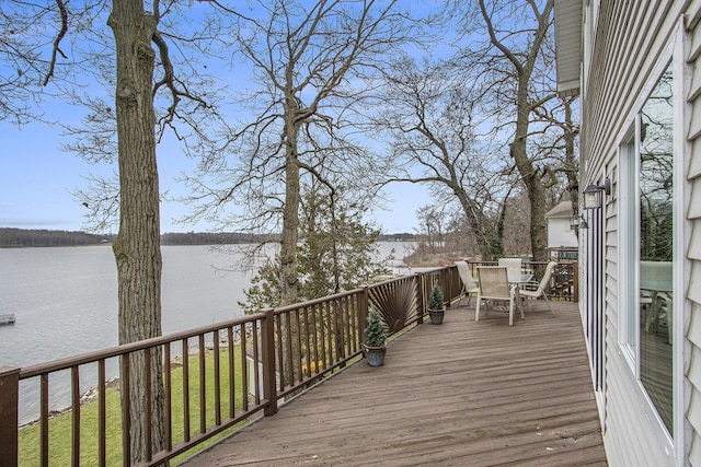 15095 N Barton Lake Dr, Vicksburg, MI 49097 - wooden terrace featuring outdoor dining area and a water view