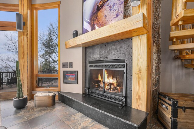 6993 S Lakeshore Dr, Pentwater, MI 49449 - room details featuring a lit fireplace