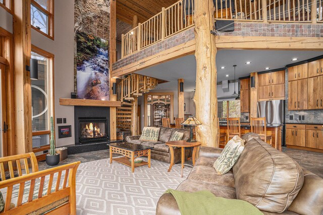 6993 S Lakeshore Dr, Pentwater, MI 49449 - living room with visible vents, recessed lighting, a high ceiling, and a fireplace