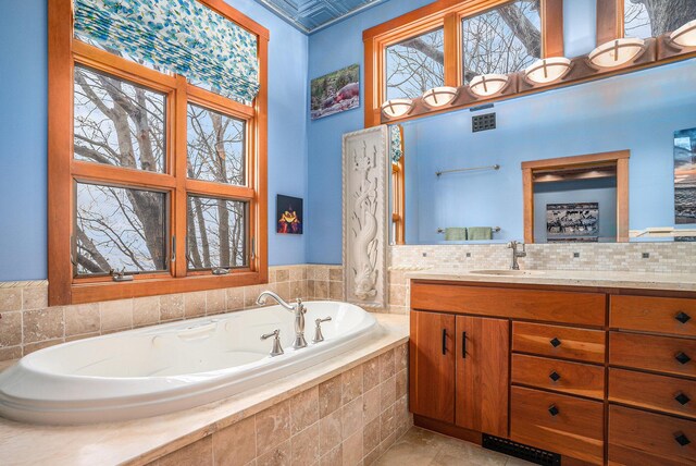 6993 S Lakeshore Dr, Pentwater, MI 49449 - full bath with vanity, a bath, and visible vents