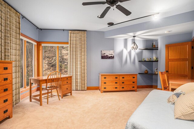 6993 S Lakeshore Dr, Pentwater, MI 49449 - carpeted bedroom featuring baseboards and ceiling fan
