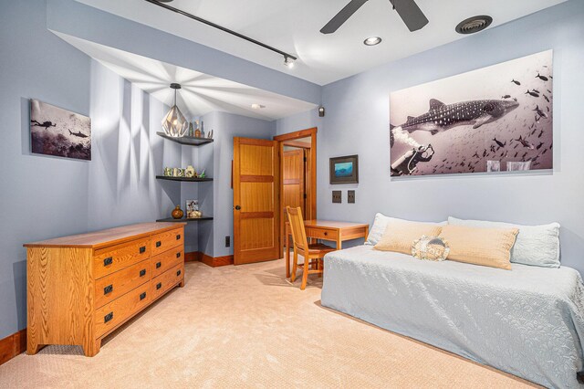 6993 S Lakeshore Dr, Pentwater, MI 49449 - carpeted bedroom featuring baseboards and ceiling fan