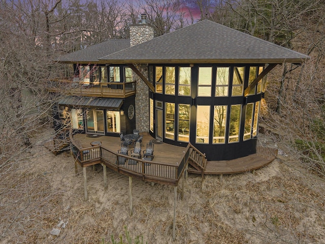 6993 S Lakeshore Dr, Pentwater, MI 49449 - exterior space featuring roof with shingles and a chimney