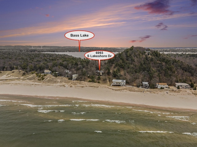 6993 S Lakeshore Dr, Pentwater, MI 49449 - aerial view at dusk featuring a view of the beach and a water view