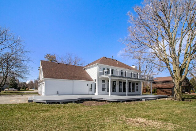6376 Sterling Dr, Newport, MI 48166 - back of house with a wooden deck, a balcony, a lawn, and a chimney