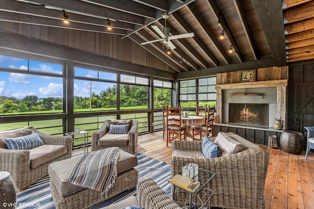 12801 Hills Rd, Buchanan, MI 49107 - sunroom with a ceiling fan, beamed ceiling, an outdoor living space with a fireplace, and track lighting