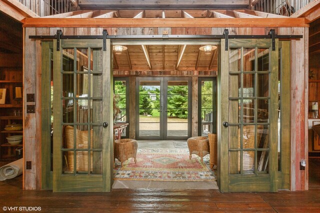 12801 Hills Rd, Buchanan, MI 49107 - interior space with hardwood / wood-style floors, french doors, and a barn door