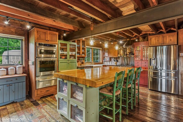 12801 Hills Rd, Buchanan, MI 49107 - kitchen with beam ceiling, butcher block countertops, stainless steel appliances, wood ceiling, and a warming drawer
