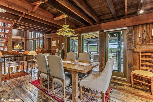 12801 Hills Rd, Buchanan, MI 49107 - dining room featuring wooden walls, wooden ceiling, beam ceiling, and hardwood / wood-style floors