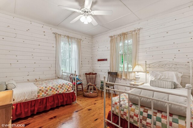 12801 Hills Rd, Buchanan, MI 49107 - bedroom with wooden walls and wood finished floors