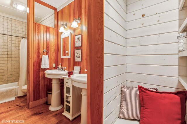 12801 Hills Rd, Buchanan, MI 49107 - full bath featuring toilet, wood walls, wood finished floors, and shower / tub combo with curtain