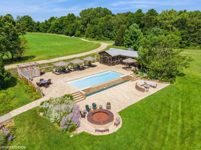 12801 Hills Rd, Buchanan, MI 49107 - outdoor pool featuring a patio, an outdoor fire pit, a yard, and a gazebo