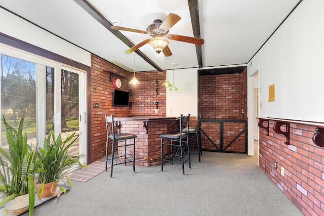 7190 Thornapple River Ct SE, Alto, MI 49302 - bar featuring ceiling fan, carpet flooring, and brick wall