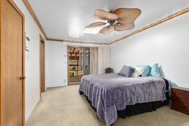 7190 Thornapple River Ct SE, Alto, MI 49302 - bedroom with ornamental molding, access to outside, light colored carpet, and a ceiling fan