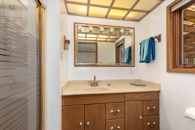 7190 Thornapple River Ct SE, Alto, MI 49302 - bathroom with a shower stall, vanity, and toilet