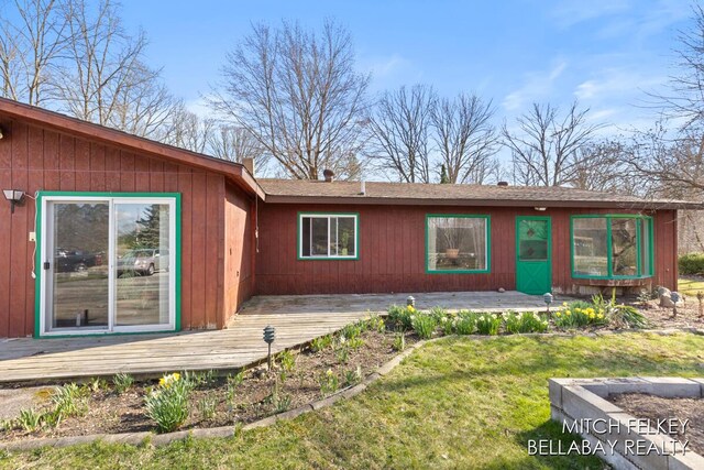 7190 Thornapple River Ct SE, Alto, MI 49302 - rear view of house with a deck and a lawn