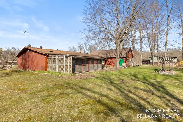 7190 Thornapple River Ct SE, Alto, MI 49302 - view of yard featuring an outbuilding