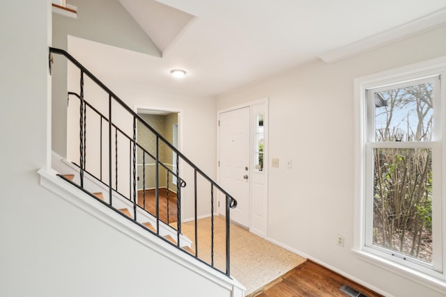 2380 Nixon Rd, Ann Arbor, MI 48105 - entryway featuring visible vents, baseboards, wood finished floors, and stairs