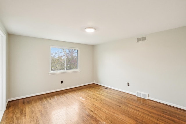 2380 Nixon Rd, Ann Arbor, MI 48105 - unfurnished room with visible vents, baseboards, and wood finished floors