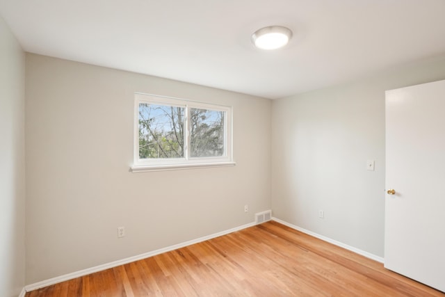 2380 Nixon Rd, Ann Arbor, MI 48105 - empty room with light wood finished floors, visible vents, and baseboards