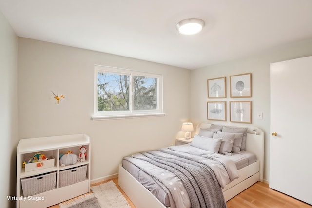 2380 Nixon Rd, Ann Arbor, MI 48105 - bedroom with baseboards and wood finished floors
