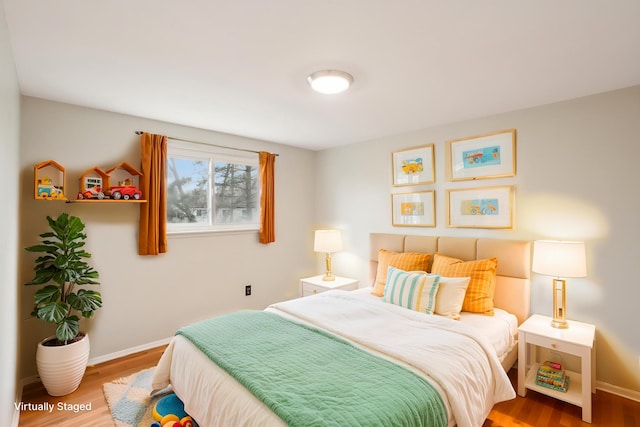 2380 Nixon Rd, Ann Arbor, MI 48105 - bedroom featuring baseboards and wood finished floors