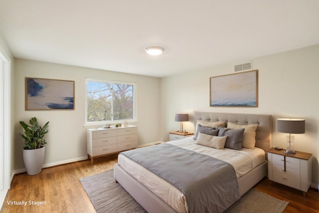 2380 Nixon Rd, Ann Arbor, MI 48105 - bedroom with wood finished floors, baseboards, and visible vents
