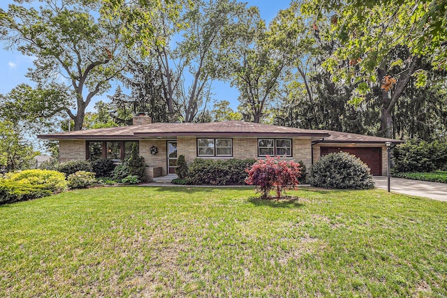 575 Glenwood Ave, Muskegon, MI 49445 - ranch-style house with an attached garage, brick siding, a front yard, and concrete driveway