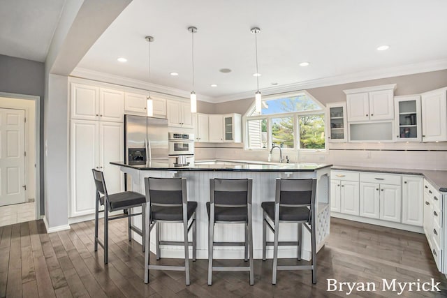 921 Meadow Ridge Dr, Holland, MI 49424 - kitchen with glass insert cabinets, white cabinets, a sink, dark wood finished floors, and decorative backsplash