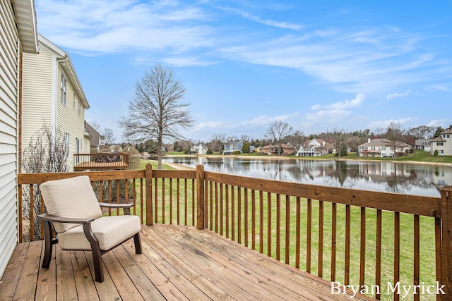 921 Meadow Ridge Dr, Holland, MI 49424 - wooden deck featuring a water view, a yard, and a residential view