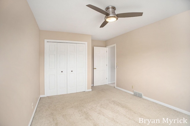 921 Meadow Ridge Dr, Holland, MI 49424 - unfurnished bedroom featuring a closet, carpet, visible vents, and baseboards