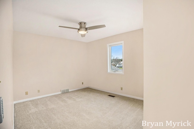 921 Meadow Ridge Dr, Holland, MI 49424 - spare room featuring visible vents, baseboards, carpet flooring, and ceiling fan