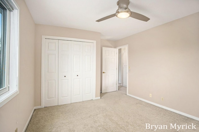 921 Meadow Ridge Dr, Holland, MI 49424 - unfurnished bedroom featuring carpet flooring, baseboards, and multiple windows