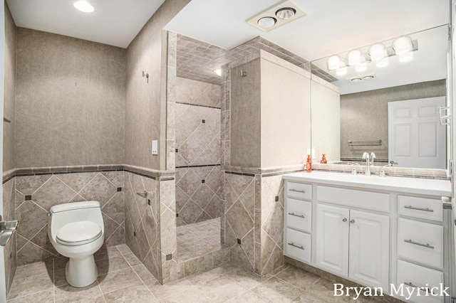 921 Meadow Ridge Dr, Holland, MI 49424 - full bathroom with walk in shower, tile patterned floors, toilet, and tile walls