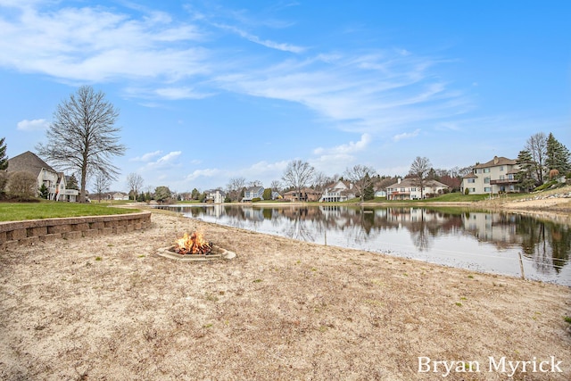 921 Meadow Ridge Dr, Holland, MI 49424 - water view featuring an outdoor fire pit and a residential view