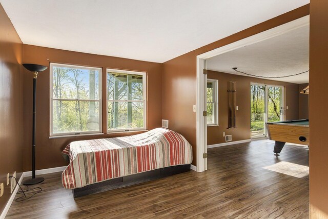 620 Twin Lakes Dr NE, Grand Rapids, MI 49525 - bedroom with baseboards, access to exterior, wood finished floors, and billiards