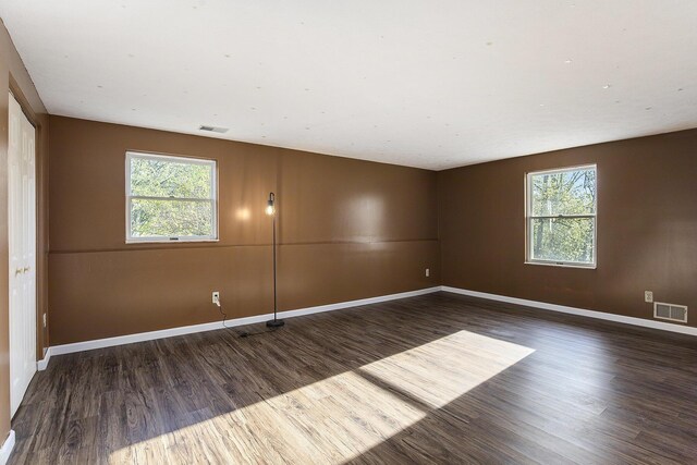 620 Twin Lakes Dr NE, Grand Rapids, MI 49525 - empty room with wood finished floors and baseboards