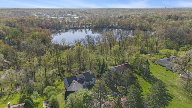 620 Twin Lakes Dr NE, Grand Rapids, MI 49525 - aerial view of property's location featuring a nearby body of water and a heavily wooded area