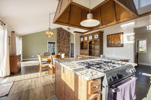 620 Twin Lakes Dr NE, Grand Rapids, MI 49525 - kitchen with black range with gas stovetop, dark wood-type flooring, baseboards, high vaulted ceiling, and a ceiling fan