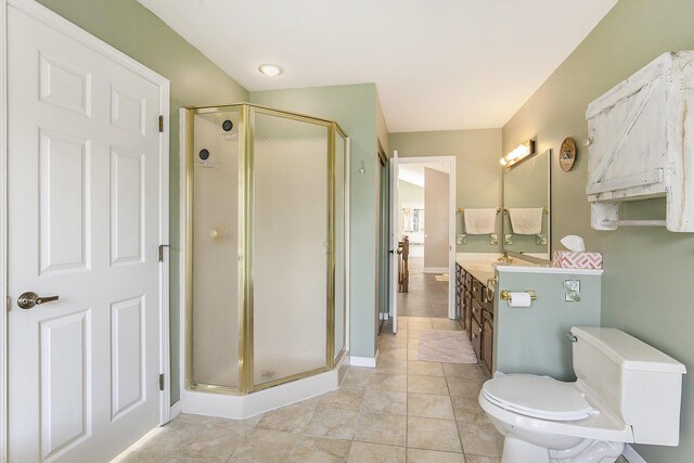 620 Twin Lakes Dr NE, Grand Rapids, MI 49525 - full bath with vanity, toilet, a stall shower, tile patterned flooring, and baseboards