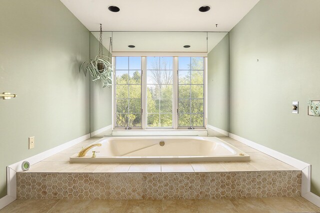 620 Twin Lakes Dr NE, Grand Rapids, MI 49525 - bathroom featuring a garden tub, tile patterned flooring, and recessed lighting