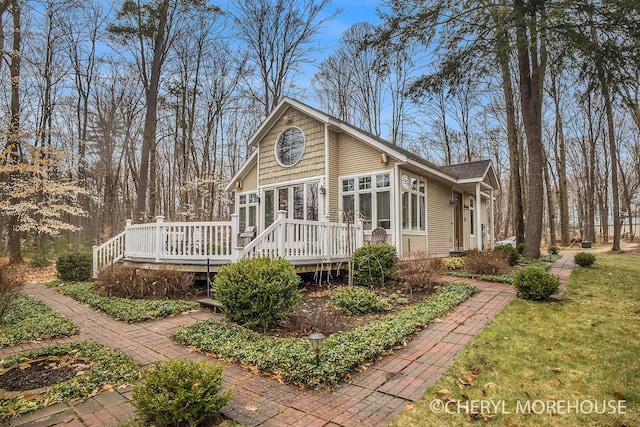 back of property with a deck