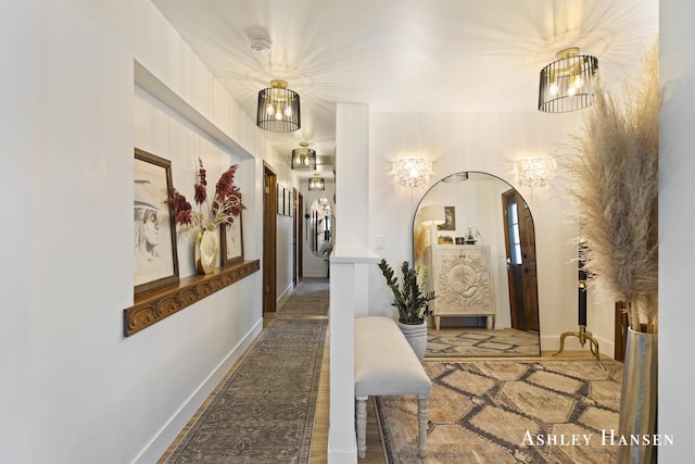 5615 Egypt Valley Ave NE, Belmont, MI 49306 - hallway with arched walkways and baseboards