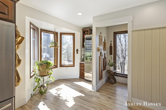 5615 Egypt Valley Ave NE, Belmont, MI 49306 - doorway to outside featuring light wood finished floors, plenty of natural light, baseboards, and recessed lighting