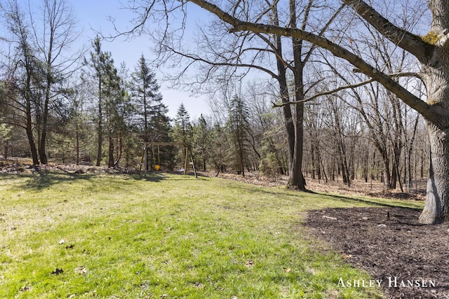 5615 Egypt Valley Ave NE, Belmont, MI 49306 - view of green lawn featuring a forest view